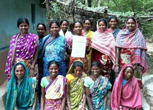 Women holding society registration certificate